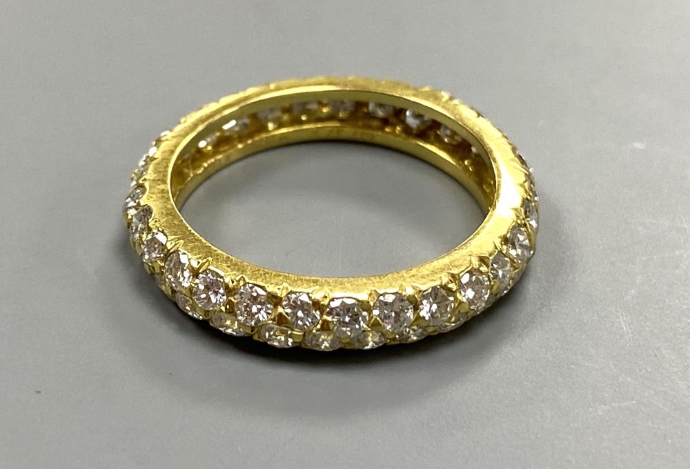 A modern Van Cleef & Arpels 750 yellow metal and two row diamond eternity ring, signed, size K, gross weight 2.7 grams.
